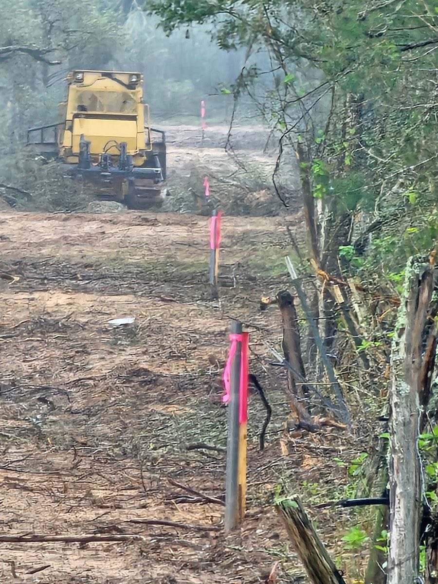 Site prep on rocky Texas ranch ground before fence installation