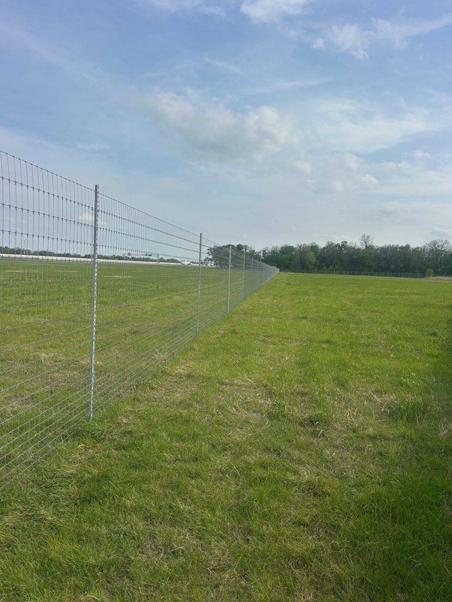 Galvanized steel high-game fence on a Texas ranch